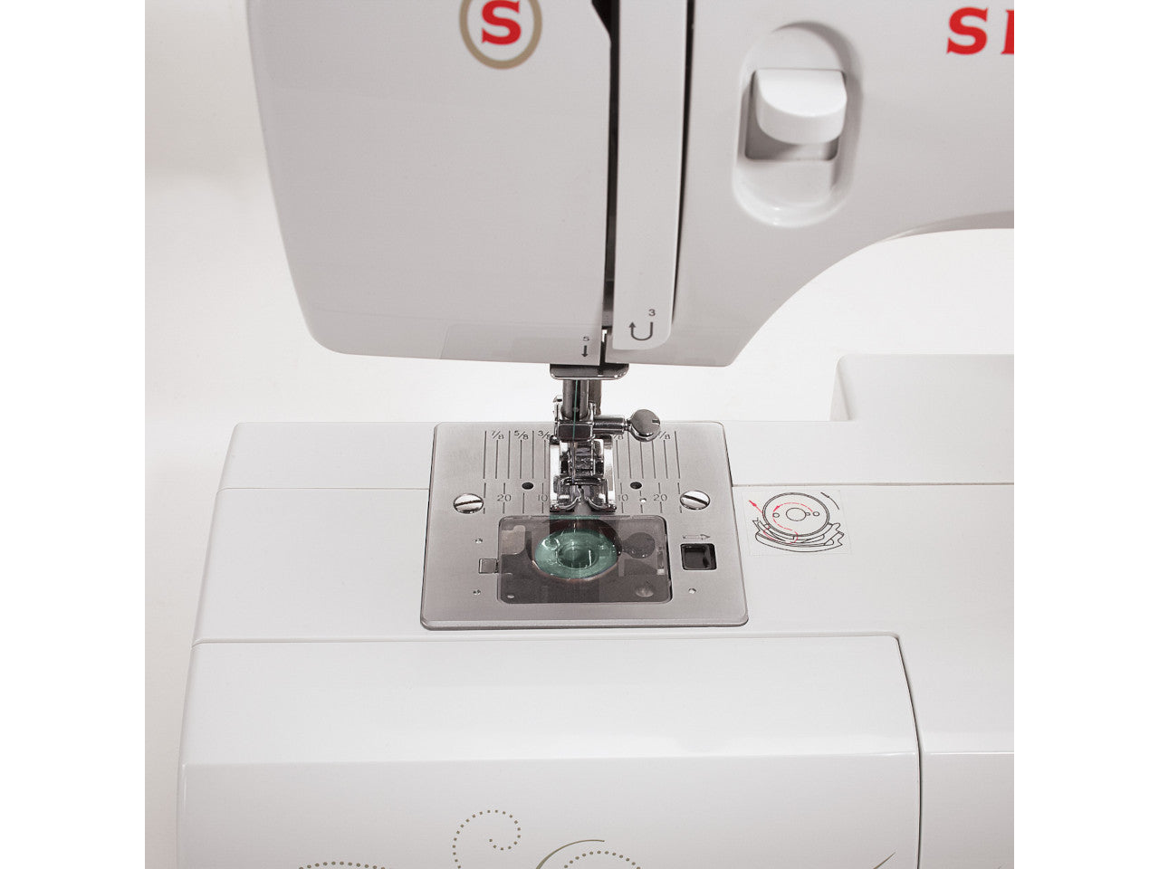 A close up of a SINGER Talent 3321 sewing machine bobbin case with jade green thread