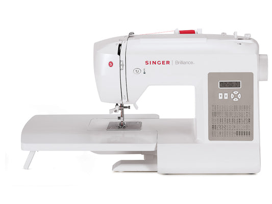 White electronic SINGER Brilliance 6180 sewing machine fitted with extension table and red thread