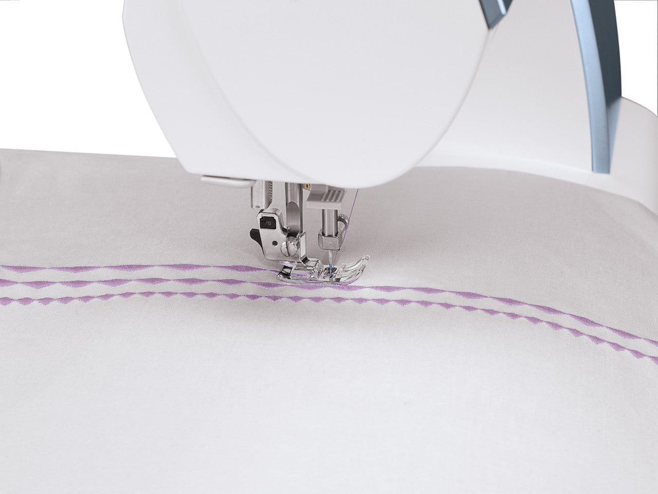 Close up of light mauve stitch elongation using the SINGER Quantum Stylist 9985 sewing machine