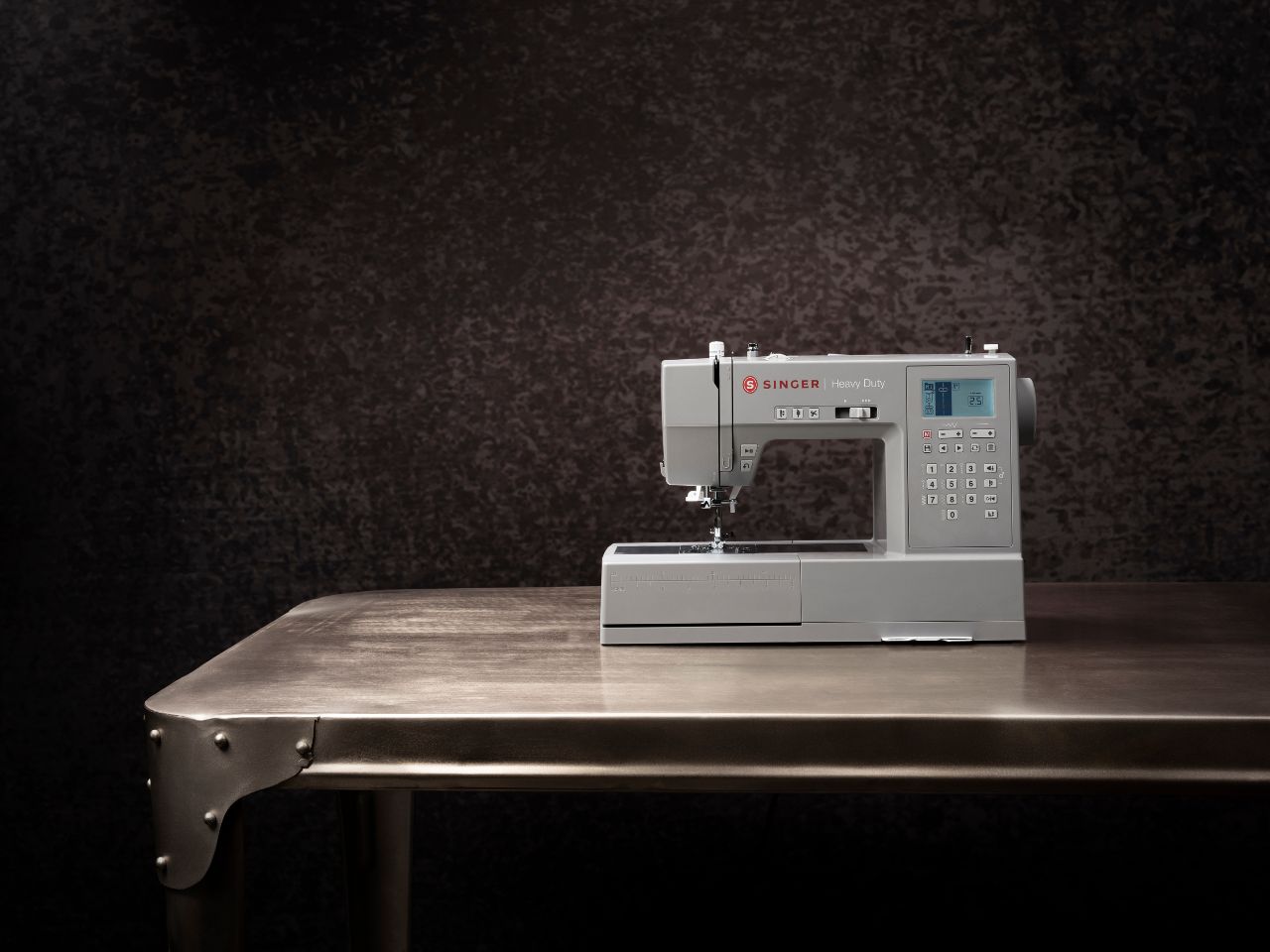 HD6805C-machine-singer-on-steel-table-image