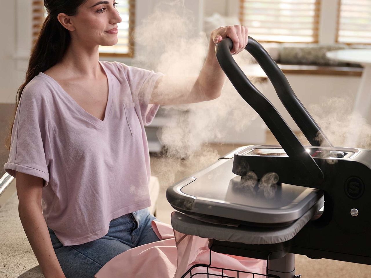 lady-using-the-esp36-steam-press-stand