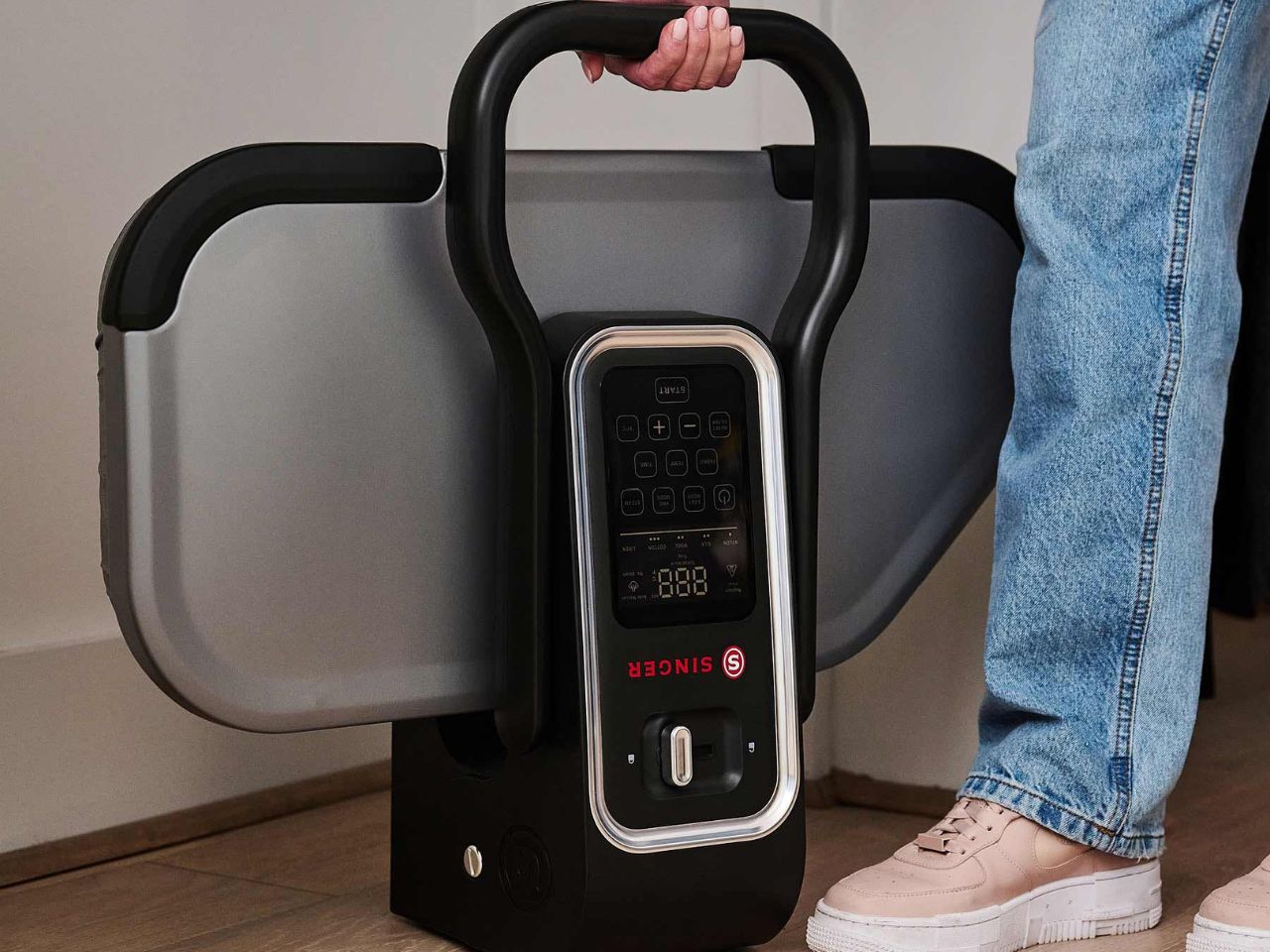 singer-esp26-steam-press-being-carried-by-handle